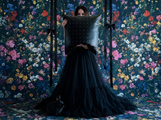 Loren Estes editorial photo with her pillow Relic in a black tulle gown, black rabbit and flowered wallpaper and flooring