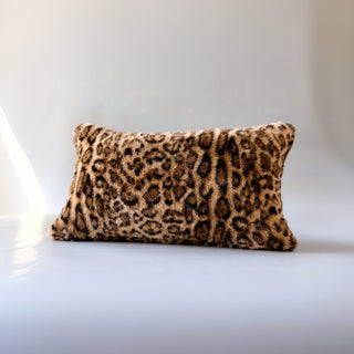A decorative throw pillow called Muse by Loren Estes. Lumbar faux fur leopard throw pillow back view
