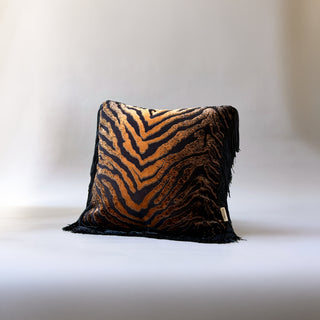 A decorative throw pillow called Sable by Loren Estes. Square cut pile tiger print fabric with black fringe